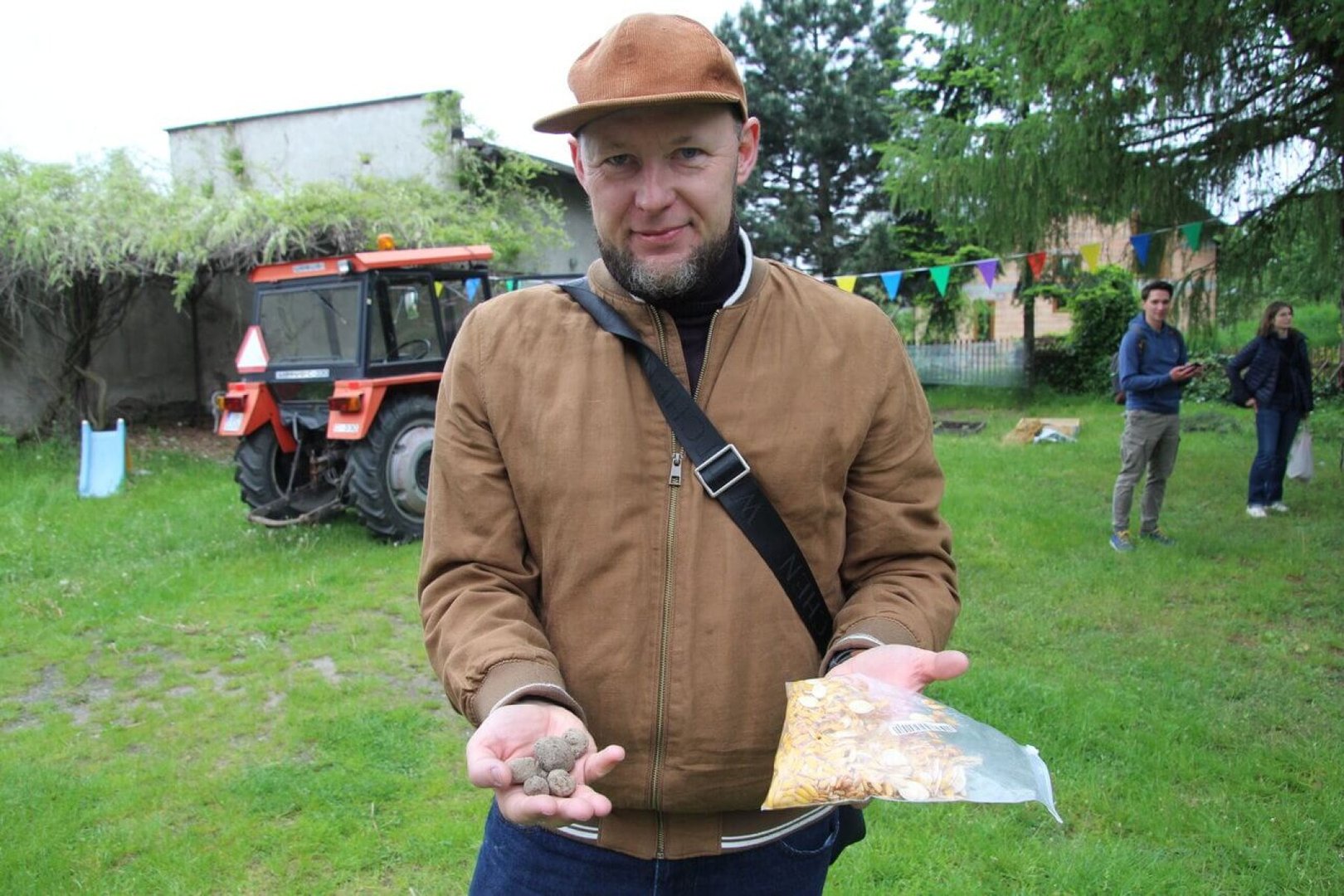 Man with seeds in the community garden.